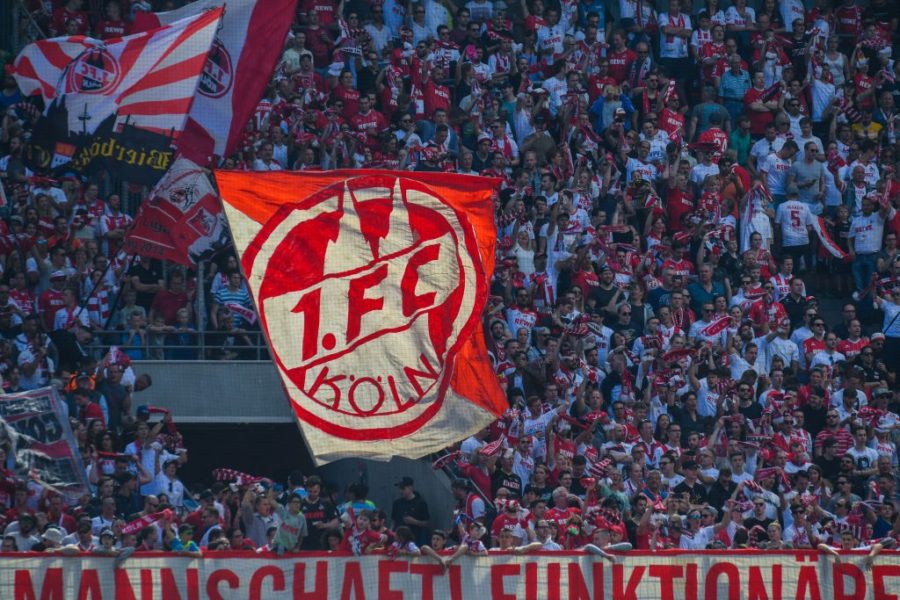 Cologne supporter wave flags during the German first division Bundesliga football match FC Cologne vs FC Bayern Munich in Cologne, western Germany, on May 5, 2018. (Photo by Patrik STOLLARZ / AFP) / RESTRICTIONS: DURING MATCH TIME: DFL RULES TO LIMIT THE ONLINE USAGE TO 15 PICTURES PER MATCH AND FORBID IMAGE SEQUENCES TO SIMULATE VIDEO. == RESTRICTED TO EDITORIAL USE == FOR FURTHER QUERIES PLEASE CONTACT DFL DIRECTLY AT + 49 69 650050 (Photo credit should read PATRIK STOLLARZ/AFP/Getty Images)