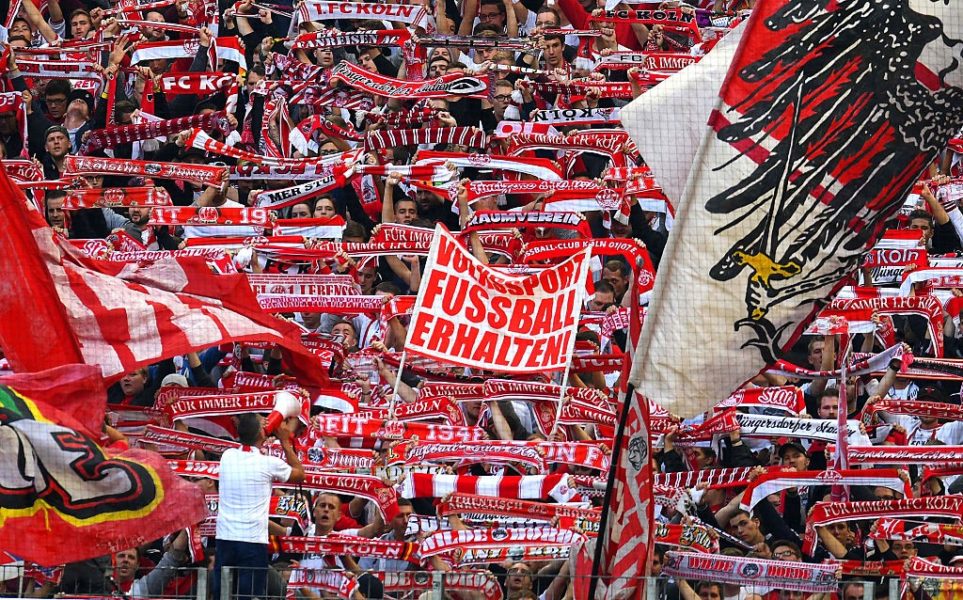 Cologne´s supporters celebrate during the German first division Bundesliga football match between FC Cologne and FC Ingolstadt 04, in Cologne, western Germany, on October 15, 2016. / AFP / PATRIK STOLLARZ / RESTRICTIONS: DURING MATCH TIME: DFL RULES TO LIMIT THE ONLINE USAGE TO 15 PICTURES PER MATCH AND FORBID IMAGE SEQUENCES TO SIMULATE VIDEO. == RESTRICTED TO EDITORIAL USE == FOR FURTHER QUERIES PLEASE CONTACT DFL DIRECTLY AT + 49 69 650050 (Photo credit should read PATRIK STOLLARZ/AFP/Getty Images)