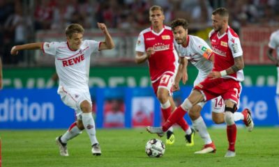 COLOGNE, GERMANY - AUGUST 13: Niklas Hauptmann of Cologne (L), Jonas Hector of Cologne (C) and Marcel Hartel of Union Berlin battle for the ball during the Second Bundesliga match between 1. FC Koeln and 1. FC Union Berlin at RheinEnergieStadion on August 13, 2018 in Cologne, Germany. (Photo by Juergen Schwarz/Bongarts/Getty Images)