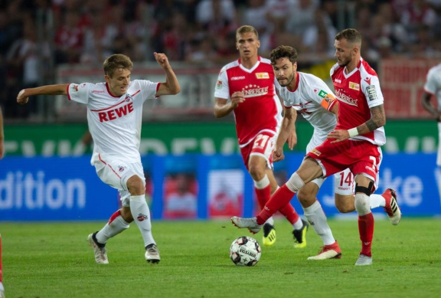 COLOGNE, GERMANY - AUGUST 13: Niklas Hauptmann of Cologne (L), Jonas Hector of Cologne (C) and Marcel Hartel of Union Berlin battle for the ball during the Second Bundesliga match between 1. FC Koeln and 1. FC Union Berlin at RheinEnergieStadion on August 13, 2018 in Cologne, Germany. (Photo by Juergen Schwarz/Bongarts/Getty Images)