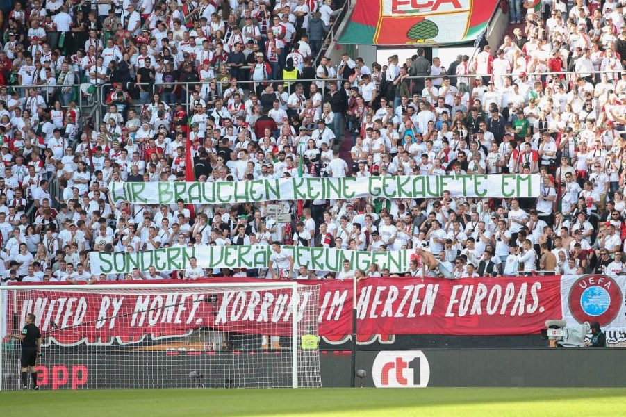 AUGSBURG, GERMANY - SEPTEMBER 22: Fans demonstrate with a banner aganist the candidation of Germany for the EURO2024 during the Bundesliga match between FC Augsburg and SV Werder Bremen at WWK-Arena on September 22, 2018 in Augsburg, Germany. (Photo by Christian Kaspar-Bartke/Bongarts/Getty Images)