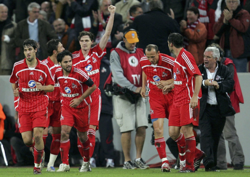 COLOGNE, GERMANY - OCTOBER 24: Milivoje Novakovic of Cologne celebrates scoring the second goal with team mates and coach Hanspeter Latour (R) during the DFB German Cup second round match between 1. FC Cologne and FC Schalke 04 at the RheinEnergie Stadium on October 24, 2006 in Cologne, Germany. (Photo by Lars Baron/Bongarts/Getty Images)