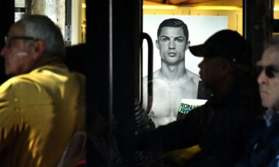 A passenger bus drives past an advertising poster for an underwear brand, showing a picture of Juventus' Portuguese forward Cristiano Ronaldo, on October 9, 2018 in downtown Rome. - Cristiano Ronaldo faces rape allegations after US police on October 1, 2018 re-opened an investigation into claims by former American model Kathryn Mayorga that the five-time Ballon d'Or winner raped her in a Las Vegas hotel in June 2009. (Photo by Alberto PIZZOLI / AFP) (Photo credit should read ALBERTO PIZZOLI/AFP/Getty Images)