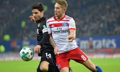 HAMBURG, GERMANY - JANUARY 20: Lewis Holtby of Hamburg is challenged by Jonas Hector of Cologne during the Bundesliga match between Hamburger SV and 1. FC Koeln at Volksparkstadion on January 20, 2018 in Hamburg, Germany. (Photo by Stuart Franklin/Bongarts/Getty Images)