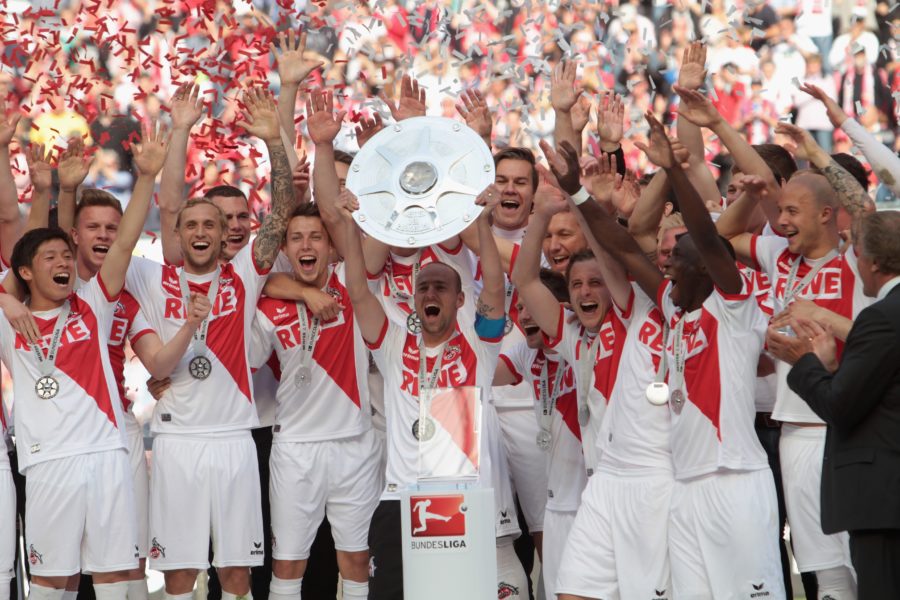 COLOGNE, GERMANY - MAY 04: Team captain Miso Brecko of Cologne lifts the trophy after winning the championship title of the Second Bundesliga at RheinEnergieStadion on May 4, 2014 in Cologne, Germany. (Photo by Juergen Schwarz/Bongarts/Getty Images)