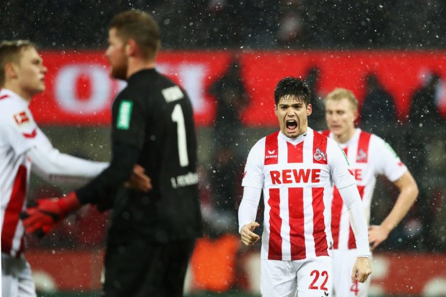 COLOGNE, GERMANY - DECEMBER 16: Jorge Mere, Timo Horn and Tim Handwerker of FC Koeln celebrate after victory in the Bundesliga match between 1. FC Koeln and VfL Wolfsburg at RheinEnergieStadion on December 16, 2017 in Cologne, Germany. (Photo by Dean Mouhtaropoulos/Bongarts/Getty Images)