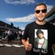 SUZUKA, JAPAN - OCTOBER 07: German football player Lukas Podolski poses for a photo on the grid before the Formula One Grand Prix of Japan at Suzuka Circuit on October 7, 2018 in Suzuka. (Photo by Mark Thompson/Getty Images)