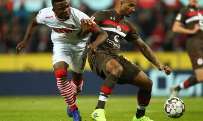 COLOGNE, GERMANY - FEBRUARY 08: Christopher Avevor of FC St. Pauli holds off Jhon Cordoba of FC Koln during the Second Bundesliga match between 1. FC Koeln and FC St. Pauli at RheinEnergieStadion on February 08, 2019 in Cologne, Germany. (Photo by Maja Hitij/Bongarts/Getty Images)