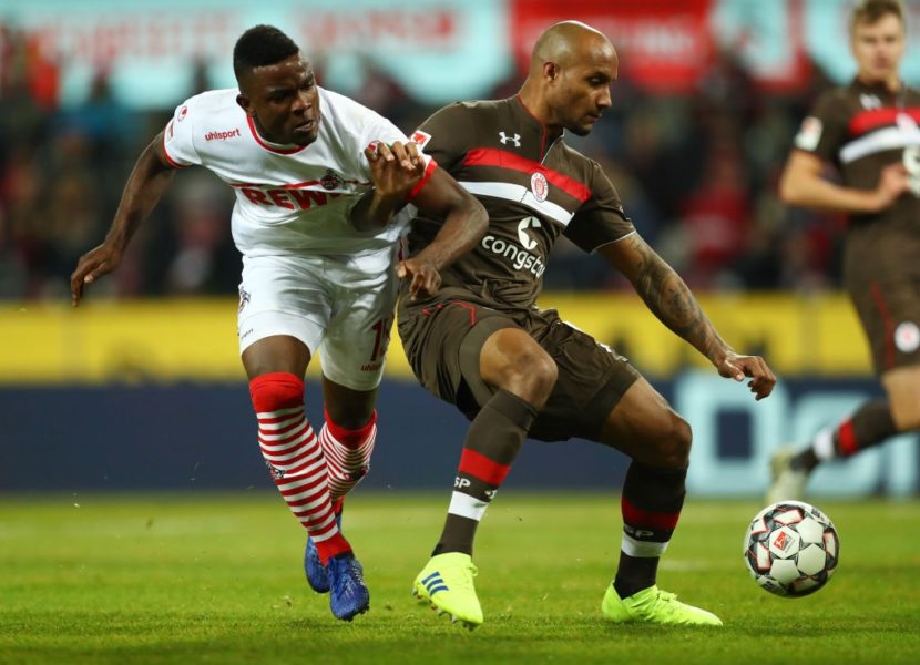 COLOGNE, GERMANY - FEBRUARY 08: Christopher Avevor of FC St. Pauli holds off Jhon Cordoba of FC Koln during the Second Bundesliga match between 1. FC Koeln and FC St. Pauli at RheinEnergieStadion on February 08, 2019 in Cologne, Germany. (Photo by Maja Hitij/Bongarts/Getty Images)