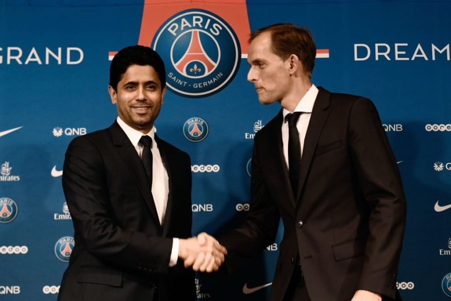 French Ligue 1 football club Paris Saint-Germain's newly appointed coach German Thomas Tuchel (R) shakes hand with club's president Nasser Al-Khelaifi at the end of a press conference to officially present him as the club's new recruit on May 20, 2018 at the Parc des Princes stadium in Paris