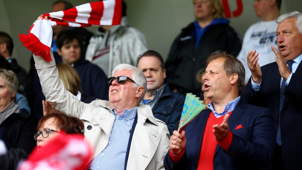 COLOGNE, GERMANY - MAY 25: President Werner Spinner and vice-president Markus Ritterbach of Koeln sing the anthem prior to the Women's 2nd Bundesliga match between 1. FC Koeln and Bayern Muenchen II at Franz-Kremer Stadium on May 25, 2015 in Cologne, Germany. (Photo by Christof Koepsel/Bongarts/Getty Images)