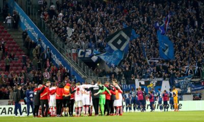 COLOGNE, GERMANY - APRIL 15: Team members of Hamburg celebrate with their fans after the Second Bundesliga match between 1. FC Koeln and Hamburger SV at RheinEnergieStadion on April 15, 2019 in Cologne, Germany. (Photo by Lars Baron/Bongarts/Getty Images)