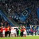 COLOGNE, GERMANY - APRIL 15: Team members of Hamburg celebrate with their fans after the Second Bundesliga match between 1. FC Koeln and Hamburger SV at RheinEnergieStadion on April 15, 2019 in Cologne, Germany. (Photo by Lars Baron/Bongarts/Getty Images)