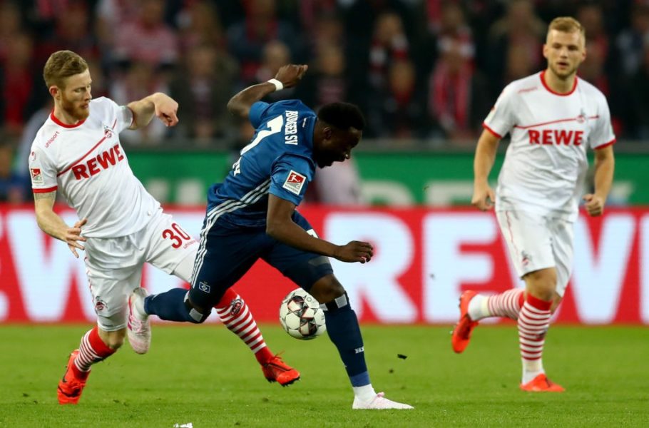 COLOGNE, GERMANY - APRIL 15: Florian Kainz (L) of Koeln challenges Khaled Narey of Hamburg during the Second Bundesliga match between 1. FC Koeln and Hamburger SV at RheinEnergieStadion on April 15, 2019 in Cologne, Germany. (Photo by Lars Baron/Bongarts/Getty Images)