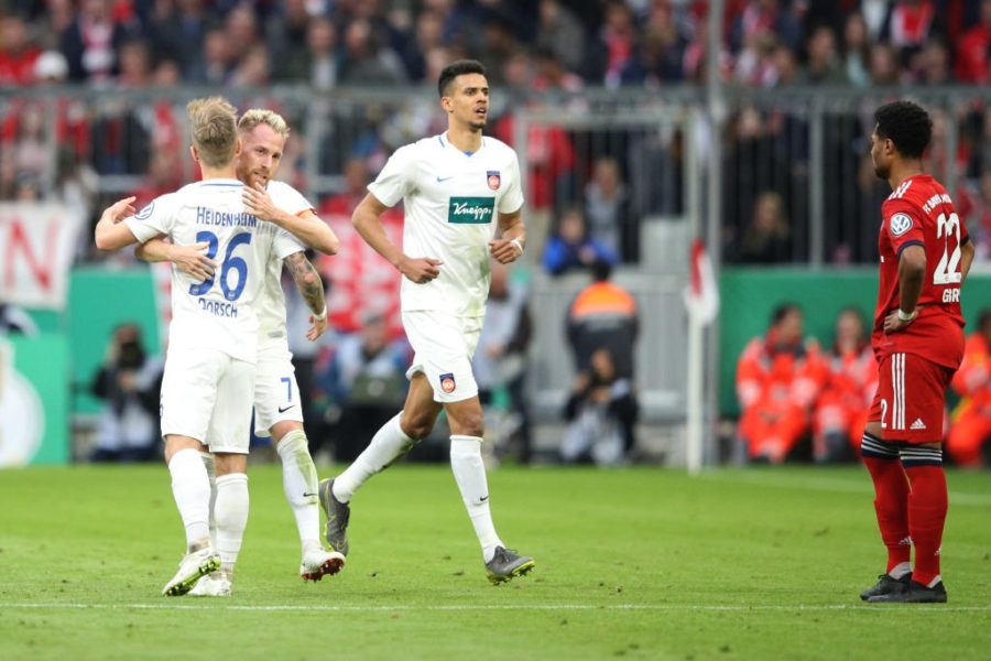 MUNICH, GERMANY - APRIL 03: Marc Schnatterer of Heidenheim celebrates his team's second goal with team mate Niklas Dorsch during the DFB Cup quarterfinal match between Bayern Muenchen and 1. FC Heidenheim at Allianz Arena on April 03, 2019 in Munich, Germany. (Photo by Adam Pretty/Bongarts/Getty Images)