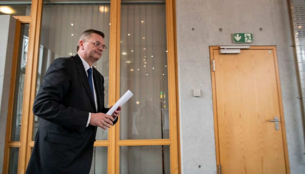 FRANKFURT AM MAIN, GERMANY - APRIL 02: Reinhard Grindel, President of the German Football Association (DFB), leaves a press conference at DFB Headquarter on April 02, 2019 in Frankfurt am Main, Germany. Grindel has stepped down as president, effective immediately. This was confirmed by the DFB today after German media reported on financial irregularities. The two vice presidents Rainer Koch and Reinhard Rauball will take over the leadership of the association on an interim basis until the DFB Bundestag in September. (Photo by Alexander Scheuber/Bongarts/Getty Images)