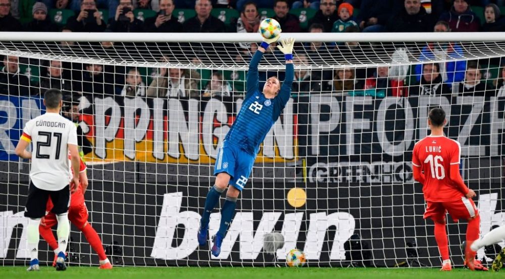 Germany's goalkeeper Marc-Andre ter Stegen makes a save during the friendly football match Germany v Serbia in Wolfsburg, western Germany on March 20, 2019. (Photo by John MACDOUGALL / AFP) / RESTRICTIONS: ACCORDING TO DFB RULES IMAGE SEQUENCES TO SIMULATE VIDEO IS NOT ALLOWED DURING MATCH TIME. MOBILE (MMS) USE IS NOT ALLOWED DURING AND FOR FURTHER TWO HOURS AFTER THE MATCH. == RESTRICTED TO EDITORIAL USE == FOR MORE INFORMATION CONTACT DFB DIRECTLY AT +49 69 67880 / (Photo credit should read JOHN MACDOUGALL/AFP/Getty Images)