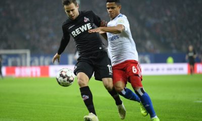 HAMBURG, GERMANY - NOVEMBER 05: Douglas Santos (R) of Hamburg is challenged for the ball by Louis Schaub (L) of Koeln during the Second Bundesliga match between Hamburger SV and 1. FC Koeln at Volksparkstadion on November 5, 2018 in Hamburg, Germany. (Photo by Oliver Hardt/Bongarts/Getty Images)