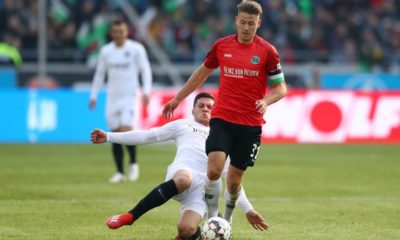 HANOVER, GERMANY - FEBRUARY 24: Waldemar Anton of Hannover 96 is challenged by Luka Jovic of Eintracht Frankfurt during the Bundesliga match between Hannover 96 and Eintracht Frankfurt at HDI-Arena on February 24, 2019 in Hanover, Germany. (Photo by Martin Rose/Bongarts/Getty Images)