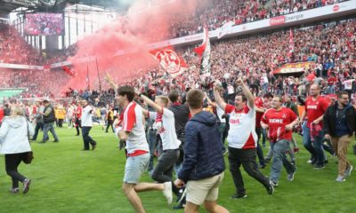 COLOGNE, GERMANY - MAY 20: Supporters of Cologne run on the pitch after the Bundesliga match between 1. FC Koeln and 1. FSV Mainz 05 at RheinEnergieStadion on May 20, 2017 in Cologne, Germany. Cologne will play Europe League next season. (Photo by Juergen Schwarz/Bongarts/Getty Images)