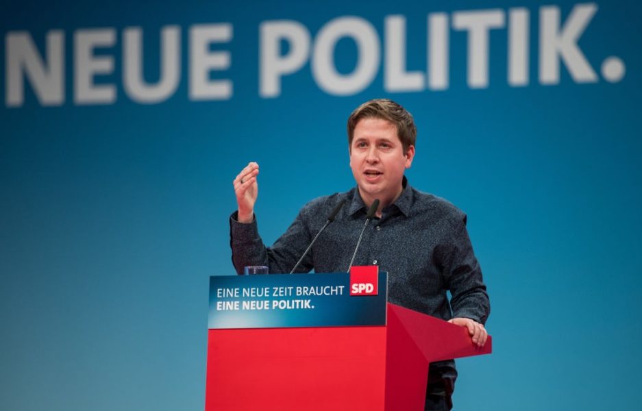 BONN, GERMANY - JANUARY 21: Kevin Kuehnert, leader of Germany's social democratic SPD party's youth organisation 'Jusos', speaks to delegates at the SPD federal congress on January 21, 2018 in Bonn, Germany. The SPD is holding the congress to decide on whether to join the German Christian Democrats (CDU/CSU) in a new German coalition government. Recent preliminary talks between the SPD, the CDU and the CSU finished with enough support from party leaderships to launch negotiations, though the SPD still needs the approval of its party base. Many SPD members have warned against the coalition and would rather see the party remain in the opposition. (Photo by Lukas Schulze/Getty Images)