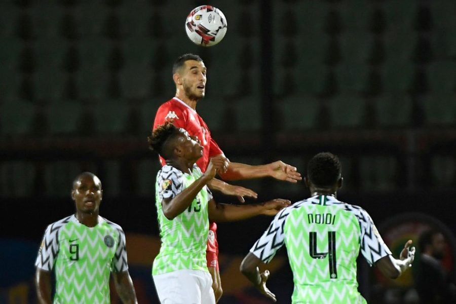 Tunisia's midfielder Ellyes Skhiri (top-C) heads the ball over Nigeria's forward Samuel Chukwueze (bottom-) during the 2019 Africa Cup of Nations (CAN) third place play-off football match between Tunisia and Nigeria at the Al Salam stadium in Cairo on July 17, 2019. (Photo by Khaled DESOUKI / AFP) (Photo credit should read KHALED DESOUKI/AFP/Getty Images)