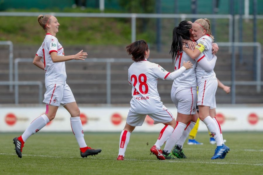 COLOGNE, GERMANY - MAY 12: Anna Isabelle Linden, Yuka Hirano, and Peggy Nietgen and Anna Kirschbaum of Koeln celebrate their goal during the women's second Bundesliga match between 1.FC Koeln and 1.FC Saarbruecken at Franz-Kremer Stadion on May 12, 2019 in Cologne, Germany. (Photo by Jörg Halisch/Bongarts/Getty Images)