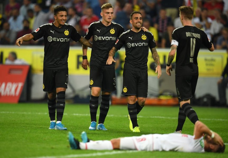 COLOGNE, GERMANY - AUGUST 23: Paco Alcacer of Borussia Dortmund (2R) celebrates with his team mates after scoring his side's third goal during the Bundesliga match between 1. FC Koeln and Borussia Dortmund at RheinEnergieStadion on August 23, 2019 in Cologne, Germany. (Photo by Matthias Hangst/Bongarts/Getty Images)