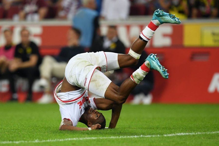 COLOGNE, GERMANY - AUGUST 23: Kingsley Ehizibue of 1. FC Koeln tumbles over during the Bundesliga match between 1. FC Koeln and Borussia Dortmund at RheinEnergieStadion on August 23, 2019 in Cologne, Germany. (Photo by Matthias Hangst/Bongarts/Getty Images)