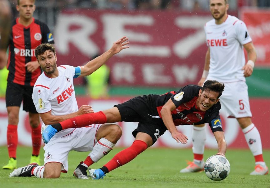 WIESBADEN, GERMANY - AUGUST 11: Jeremias Lorch of SV Wehen Wiesbaden is challenged by Jonas Hector of 1. FC Koeln during the DFB Cup first round match between SV Wehen Wiesbaden and 1. FC Koeln at BRITA-Arena on August 11, 2019 in Wiesbaden, Germany. (Photo by Matthias Hangst/Bongarts/Getty Images)