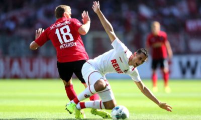 FREIBURG IM BREISGAU, GERMANY - AUGUST 31: Ellyes Skhiri of 1. FC Koln battles for possession with Nils Petersen of Sport-Club Freiburg during the Bundesliga match between Sport-Club Freiburg and 1. FC Koeln at Schwarzwald-Stadion on August 31, 2019 in Freiburg im Breisgau, Germany. (Photo by Simon Hofmann/Bongarts/Getty Images)