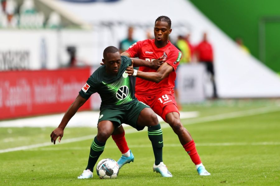 WOLFSBURG, GERMANY - AUGUST 17: Jerome Roussillon of VfL Wolfsburg is challenged by Kingsley Ehizibue of 1. FC Koln during the Bundesliga match between VfL Wolfsburg and 1. FC Koeln at Volkswagen Arena on August 17, 2019 in Wolfsburg, Germany. (Photo by Martin Rose/Bongarts/Getty Images)
