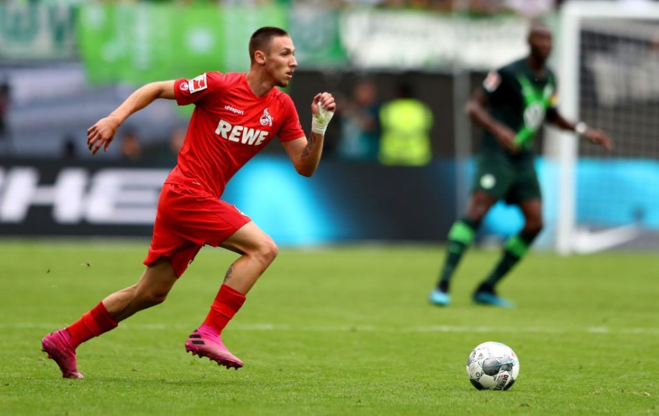 WOLFSBURG, GERMANY - AUGUST 17: Darko Churlinov of Koeln runs with the ball during the Bundesliga match between VfL Wolfsburg and 1. FC Koeln at Volkswagen Arena on August 17, 2019 in Wolfsburg, Germany. (Photo by Martin Rose/Bongarts/Getty Images)