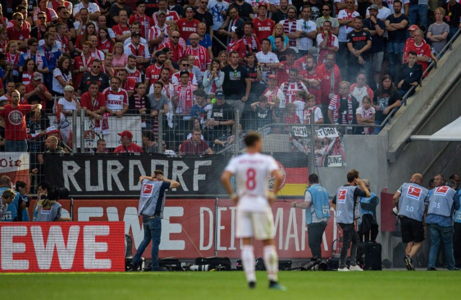 COLOGNE, GERMANY - SEPTEMBER 14: A fire cracker is thrown pitchside during the Bundesliga match between 1. FC Koeln and Borussia Moenchengladbach at RheinEnergieStadion on September 14, 2019 in Cologne, Germany. (Photo by Jörg Schüler/Bongarts/Getty Images)