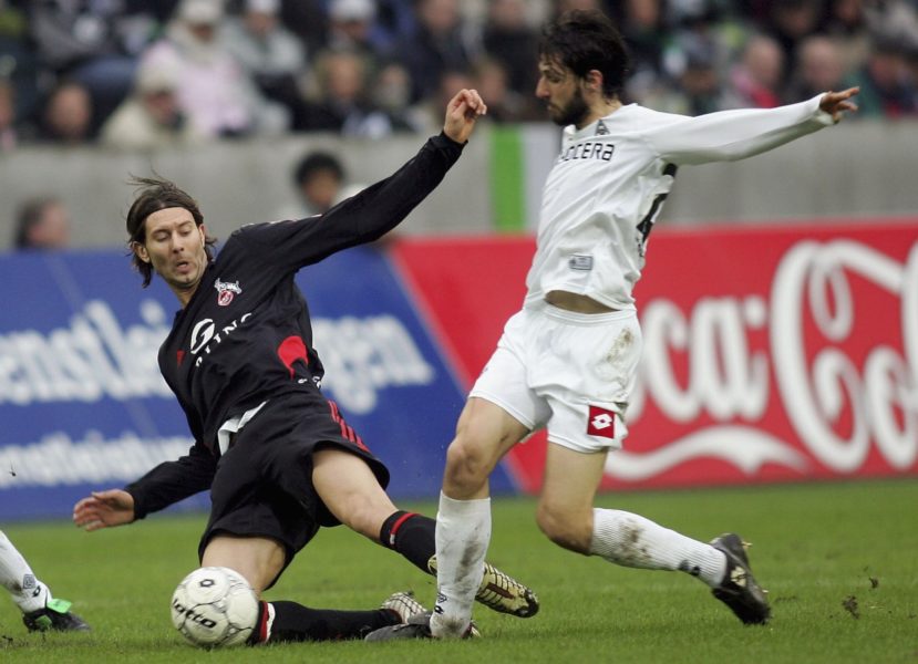 MONCHENGLADBACH, GERMANY - FEBRUARY 18: Roland Benschneider of Cologne tackles Thomas Broich of Monchengladbach and is given a red card during the Bundesliga match between Borussia Monchengladbach and 1. FC Cologne at the Borussia Park on February 18, 2006 in Monchengladbach, Germany. (Photo by Lars Baron/Bongarts/Getty Images)