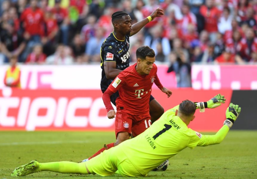 Cologne's Dutch defender Kingsley Ehizibue (L) attacks Bayern Munich's Brazilian midfielder Philippe Coutinho (C) as Cologne's German goalkeeper Timo Horn (R) dives for the ball during the German First division Bundesliga football match between FC Bayern Munich and 1 FC Cologne in Munich, on September 21, 2019. (Photo by Christof STACHE / AFP) / DFL REGULATIONS PROHIBIT ANY USE OF PHOTOGRAPHS AS IMAGE SEQUENCES AND/OR QUASI-VIDEO (Photo credit should read CHRISTOF STACHE/AFP/Getty Images)