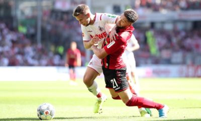 FREIBURG IM BREISGAU, GERMANY - AUGUST 31: Brandon Borrello of Sport-Club Freiburg is challenged by Louis Schaub of 1. FC Koln during the Bundesliga match between Sport-Club Freiburg and 1. FC Koeln at Schwarzwald-Stadion on August 31, 2019 in Freiburg im Breisgau, Germany. (Photo by Simon Hofmann/Bongarts/Getty Images)