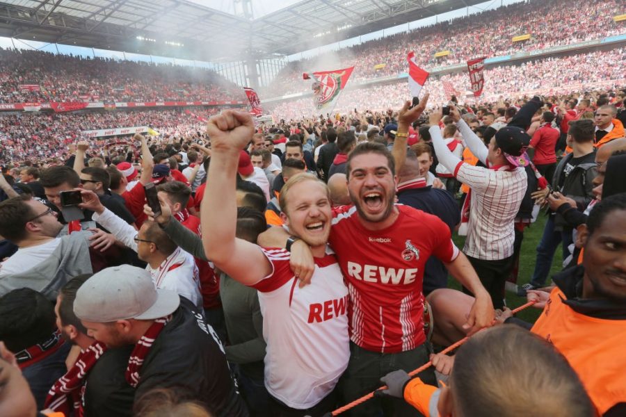 COLOGNE, GERMANY - MAY 20: Supporters of Cologne celebrate after the 2-0 win against 1. FSV Mainz 05 at RheinEnergieStadion on May 20, 2017 in Cologne, Germany. Cologne will play Europe League next season. (Photo by Juergen Schwarz/Bongarts/Getty Images)
