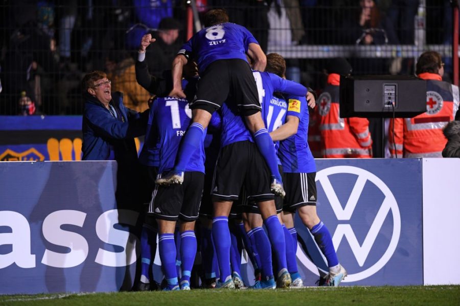 SAARBRUECKEN, GERMANY - OCTOBER 29: Christopher Schorch of 1 FC. Saarbruecken celebrates after scoring his team's first goal with his team mates during the DFB Cup second round match between 1. FC Saarbruecken and 1. FC Koeln at Ludwigspark Stadion on October 29, 2019 in Saarbruecken, Germany. (Photo by Alex Grimm/Bongarts/Getty Images)