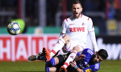 SAARBRUECKEN, GERMANY - OCTOBER 29: Dominick Drexler of 1. FC Koeln is challenged by Fanol Perdedaj of 1 FC. Saarbruecken during the DFB Cup second round match between 1. FC Saarbruecken and 1. FC Koeln at Ludwigspark Stadion on October 29, 2019 in Saarbruecken, Germany. (Photo by Alex Grimm/Bongarts/Getty Images)