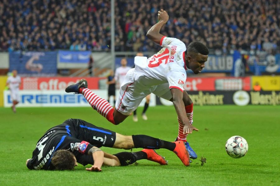 PADERBORN, GERMANY - FEBRUARY 15: Christian Strohdiek (L) of Paderborn tackles Jhon Cordoba of Koeln during the Second Bundesliga match between SC Paderborn 07 and 1. FC Koeln at Benteler Arena on February 15, 2019 in Paderborn, Germany. (Photo by Thomas F. Starke/Bongarts/Getty Images)