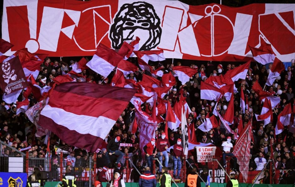 SAARBRUECKEN, GERMANY - OCTOBER 29: Fans wave flags prior to the DFB Cup second round match between 1. FC Saarbruecken and 1. FC Koeln at Ludwigspark Stadion on October 29, 2019 in Saarbruecken, Germany. (Photo by Alex Grimm/Bongarts/Getty Images)