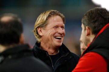 Cologne's German coach Markus Gisdol (C) laughs prior to the German first division Bundesliga football match RB Leipzig v FC Cologne in Leipzig, eastern Germany, on November 23, 2019. (Photo by Odd Andersen / AFP) / RESTRICTIONS: DFL REGULATIONS PROHIBIT ANY USE OF PHOTOGRAPHS AS IMAGE SEQUENCES AND/OR QUASI-VIDEO (Photo by ODD ANDERSEN/AFP via Getty Images)