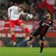 COLOGNE, GERMANY - DECEMBER 14: Sebastiaan Bornauw of 1. FC Koeln jumps for the ball against Kevin Volland of Bayer 04 Leverkusen during the Bundesliga match between 1. FC Koeln and Bayer 04 Leverkusen at RheinEnergieStadion on December 14, 2019 in Cologne, Germany. (Photo by Lars Baron/Bongarts/Getty Images)
