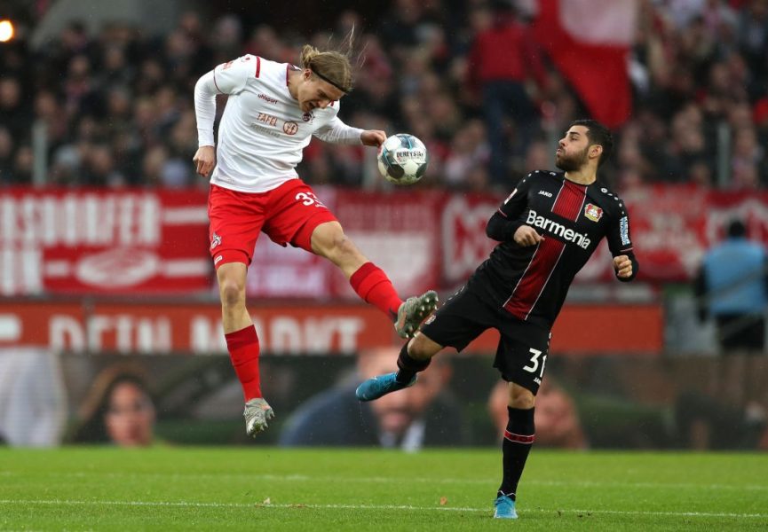COLOGNE, GERMANY - DECEMBER 14: Sebastiaan Bornauw of 1. FC Koeln jumps for the ball against Kevin Volland of Bayer 04 Leverkusen during the Bundesliga match between 1. FC Koeln and Bayer 04 Leverkusen at RheinEnergieStadion on December 14, 2019 in Cologne, Germany. (Photo by Lars Baron/Bongarts/Getty Images)
