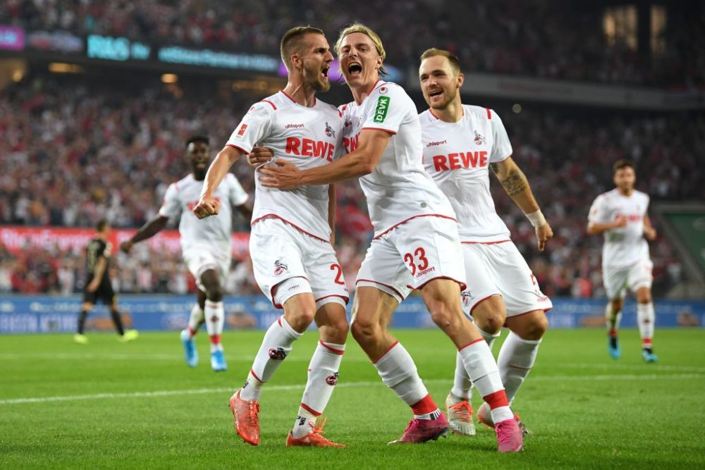 COLOGNE, GERMANY - AUGUST 23: Dominick Drexler of 1. FC Koeln (L) celebrates with his team mates after scoring his side's first goal during the Bundesliga match between 1. FC Koeln and Borussia Dortmund at RheinEnergieStadion on August 23, 2019 in Cologne, Germany. (Photo by Matthias Hangst/Bongarts/Getty Images)