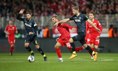 BERLIN, GERMANY - DECEMBER 08: Sebastian Andersson of 1. FC Union Berlin runs with the ball under pressure from Lasse Sobiech and Marco Hoger of 1. FC Koeln during the Bundesliga match between 1. FC Union Berlin and 1. FC Koeln at Stadion An der Alten Foersterei on December 08, 2019 in Berlin, Germany. (Photo by Maja Hitij/Bongarts/Getty Images)