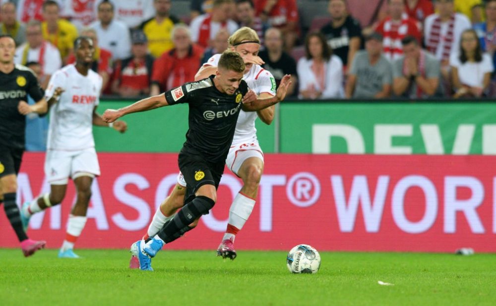 Dortmund's Belgian forward Thorgan Hazard and Cologne's Belgian defender Sebastiaan Bornauw vie for the ball during the German first division Bundesliga football match 1 FC Cologne v BVB Borussia Dortmund in Cologne, western Germany on August 23, 2019. (Photo by UWE KRAFT / AFP) / RESTRICTIONS: DFL REGULATIONS PROHIBIT ANY USE OF PHOTOGRAPHS AS IMAGE SEQUENCES AND/OR QUASI-VIDEO (Photo credit should read UWE KRAFT/AFP via Getty Images)