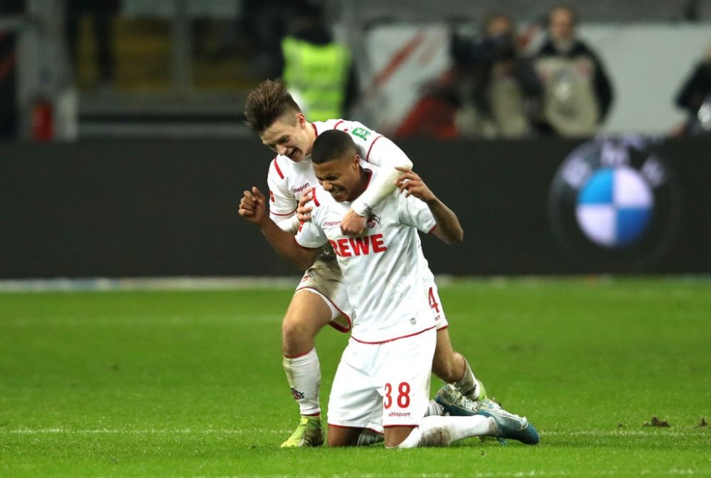 FRANKFURT AM MAIN, GERMANY - DECEMBER 18: Ismael Jakobs of 1. FC Koeln celebrates victory with Noah Katterbach after the Bundesliga match between Eintracht Frankfurt and 1. FC Koeln at Commerzbank-Arena on December 18, 2019 in Frankfurt am Main, Germany. (Photo by Alexander Hassenstein/Bongarts/Getty Images)