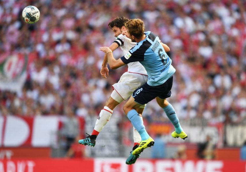 COLOGNE, GERMANY - SEPTEMBER 14: Jonas Hector of 1. FC Koln and Christoph Kramer of Borussia Monchengladbach jump for the ball during the Bundesliga match between 1. FC Koeln and Borussia Moenchengladbach at RheinEnergieStadion on September 14, 2019 in Cologne, Germany. (Photo by Jörg Schüler/Bongarts/Getty Images)